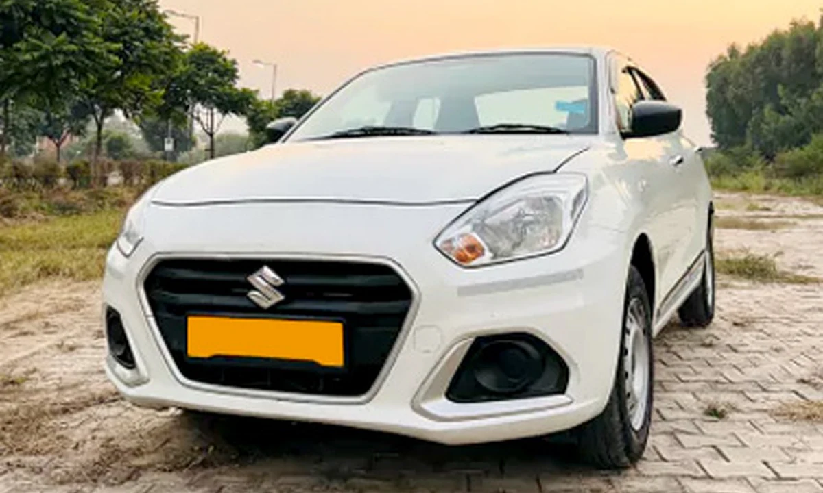 White Maruti Suzuki Dzire sedan